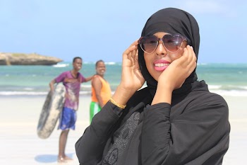 Woman Wearing Black Abaya Dress Holding Her