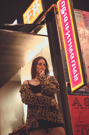 Woman Wearing Black and Brown Leopard-print Jacket
