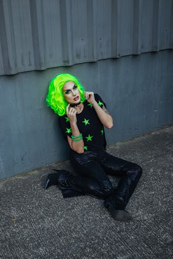 Woman Wearing Black and Green Star-print Shit