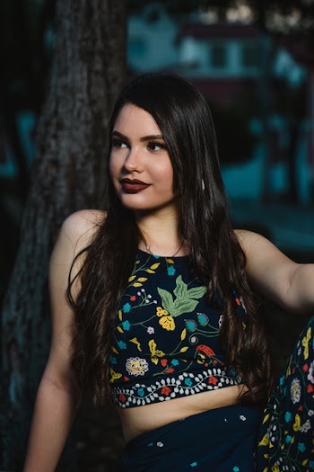 Woman Wearing Black And Multi-coloured Crop Top