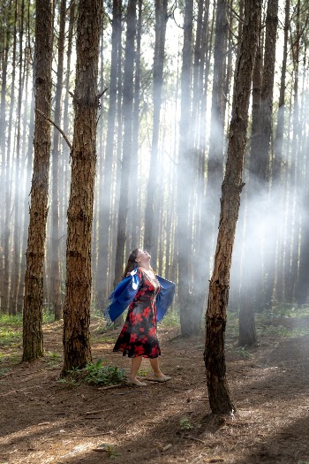 Woman Wearing Black and Red Dress Standing Near Trees
