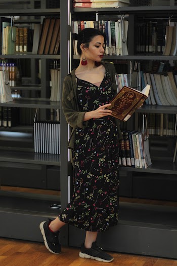 Woman Wearing Black and Red Floral Dress  Reading A Book