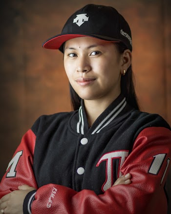Woman Wearing Black and Red Letterman Jacket While Taking Selfie