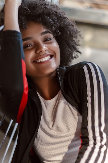 Woman Wearing Black and White Adidas Jacket