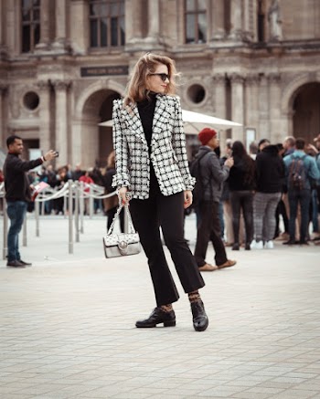 Woman Wearing Black and White Checkered Blazer Standing Pavement