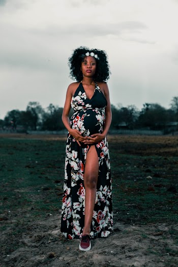 Woman Wearing Black and White Floral Dress