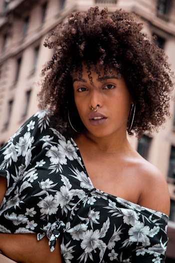 Woman Wearing Black and White Floral Top