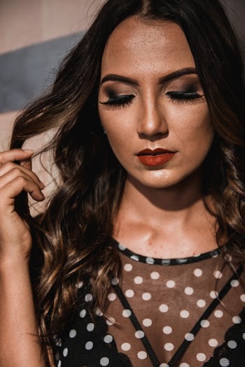 Woman Wearing Black and White Polka-dots Top