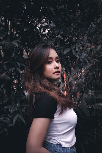 Woman Wearing Black and White Shirt Standing Near Tree