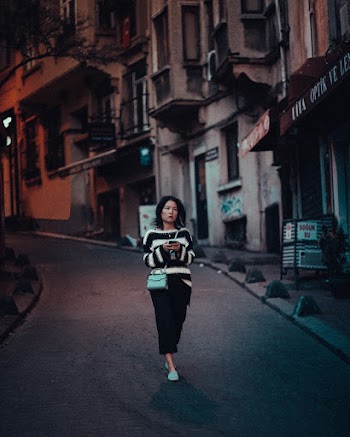 Woman Wearing Black and White Stripe Long-sleeved Dress