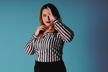 Woman Wearing Black and White Striped Button-up Long-sleeved Shirt