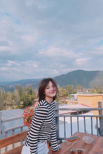 Woman Wearing Black And White Striped Long Sleeved Shirt