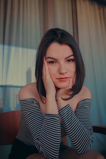 Woman Wearing Black and White Striped Off-shoulder Top