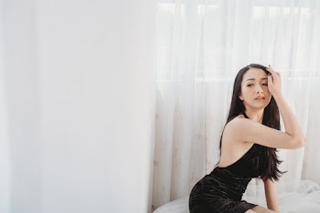 Woman Wearing Black Backless Dress