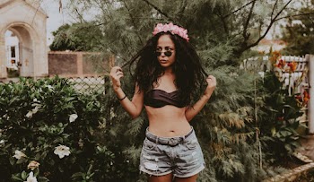Woman Wearing Black Bandeau and Blue Denim Shorts