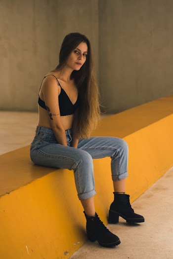 Woman Wearing Black Bikini Top Sitting on Bench