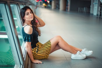 Woman Wearing Black Bloue and Yellow and Black Mini Skirt
