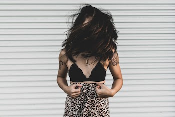 Woman Wearing Black Bra Covering Face With Hair