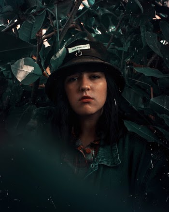 Woman Wearing Black Bucket Hat
