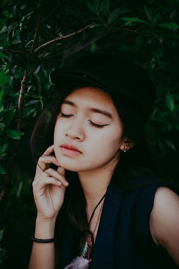 Woman Wearing Black Cap