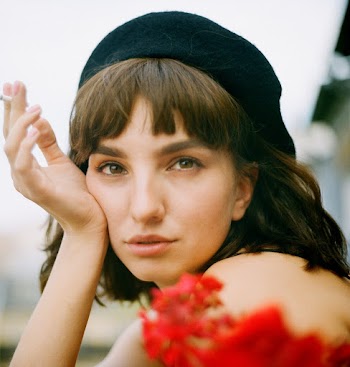 Woman Wearing Black Cap
