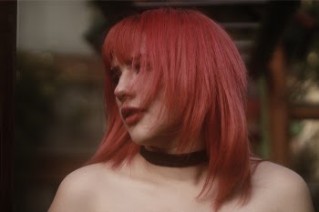 Woman Wearing Black Choker