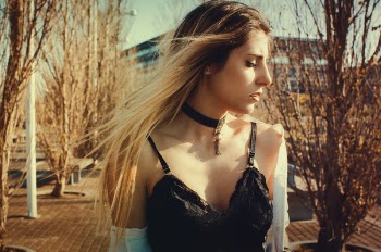 Woman Wearing Black Choker and Sleeveless Top Walking on Street
