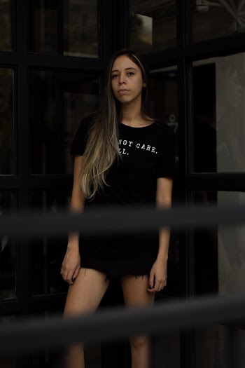 Woman Wearing Black Crew-neck Cap-sleeved Shirt