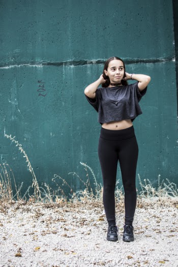 Woman Wearing Black Crew-neck Crop-top and Black High-waist Fitted Leggings
