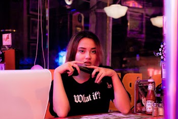 Woman Wearing Black Crew-neck Shirt Besides Heinz Tomato Ketchup Bottle