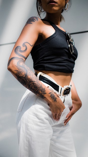 Woman Wearing Black Crop and White Jeans