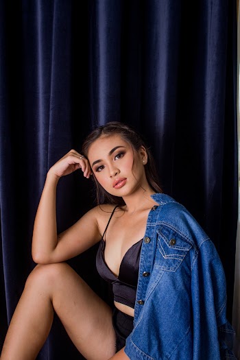 Woman Wearing Black Crop Top and Blue Denim Jacket