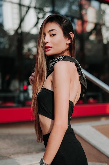 Woman Wearing Black Crop-top Near the Building
