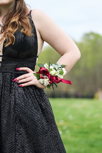 Woman Wearing Black Dress And Flower Bracelet