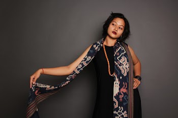 Woman Wearing Black Dress Holding Grey and Black Scarf