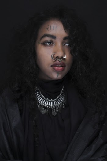 Woman Wearing Black Dress With Silver-colored Nose Piercings