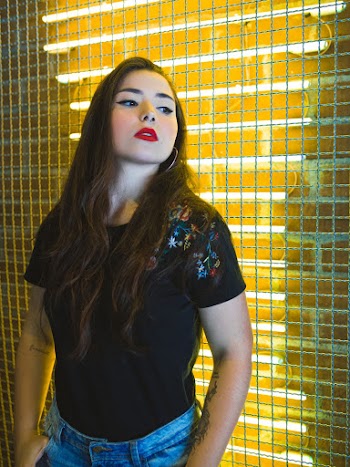 Woman Wearing Black Floral Blouse