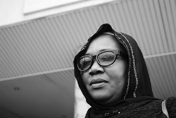 Woman Wearing Black Framed Eyeglasses and Black Scarf