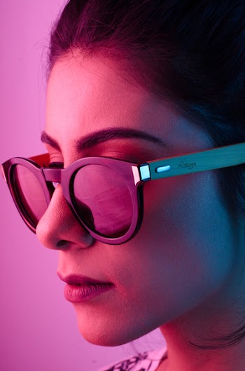 Woman Wearing Black Framed Wayfarer-style Sunglasses