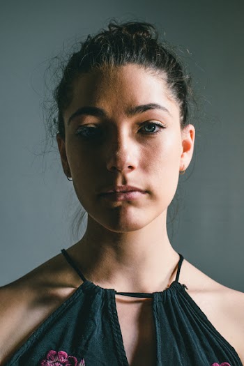 Woman Wearing Black Halter-neck Sleeveless Top