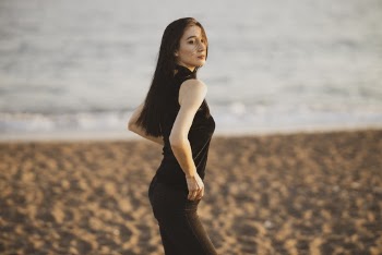 Woman Wearing Black Halter Neck Top