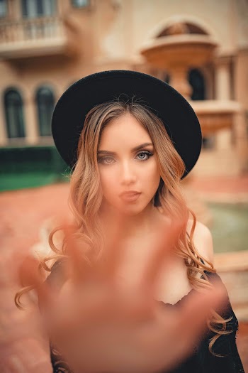 Woman Wearing Black Hat