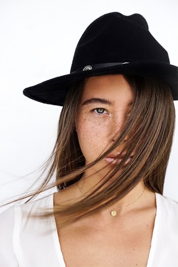 Woman Wearing Black Hat