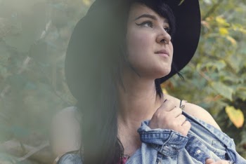 Woman Wearing Black Hat and Blue Chambray Shirt