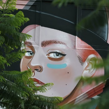 Woman Wearing Black Hat Graffiti