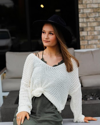 Woman Wearing Black Hat, White Knitted Long-sleeved Shirt and Gray Dress