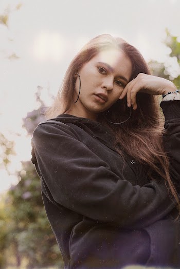 Woman Wearing Black Hoodie