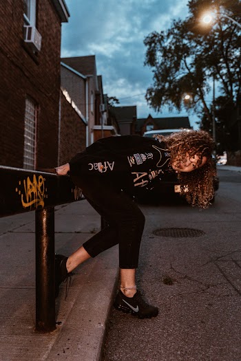 Woman Wearing Black Jacket and Pants