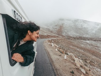 Woman Wearing Black Jacket Riding White Vehicle