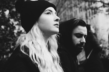 woman wearing black knit cap near man